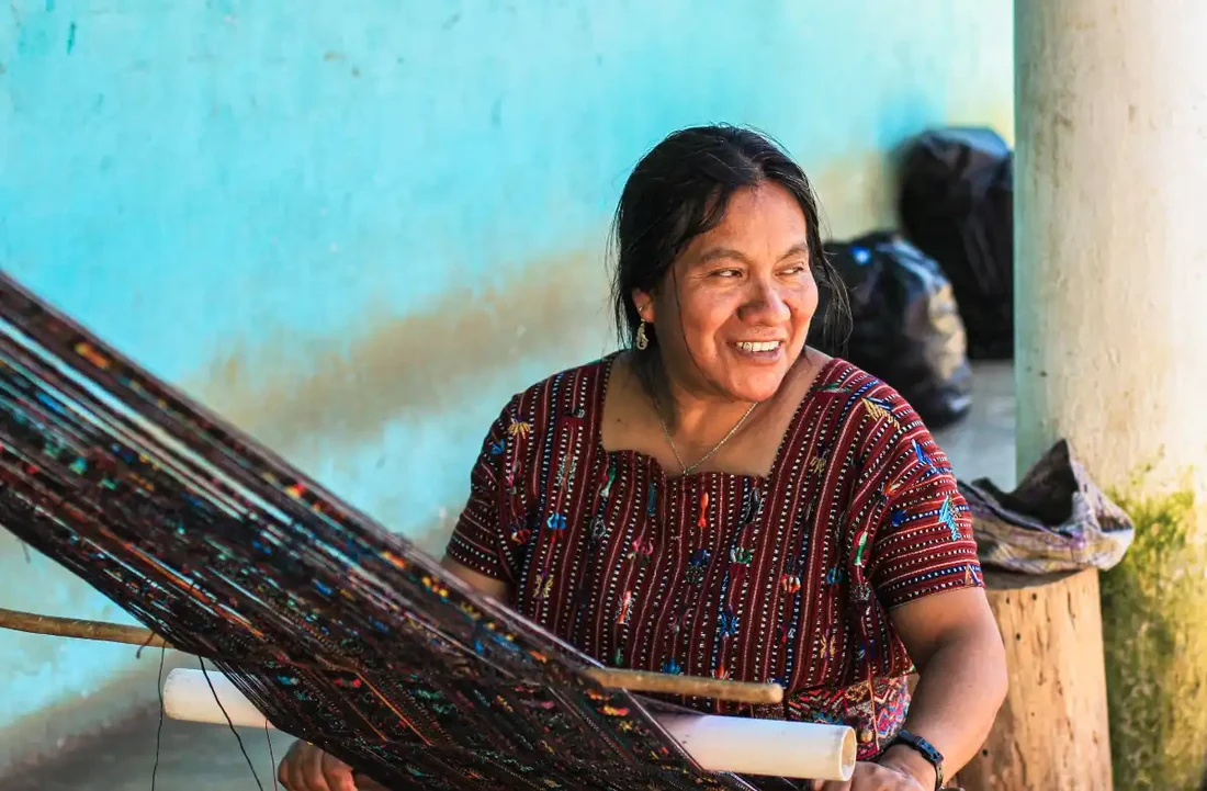 A Mam-Maya artisan weaving on a backstrap loom